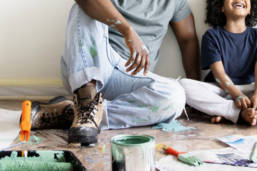 Family taking a break during a DIY painting session
